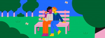 Deux filles qui s'embrassent sur un banc dans un parc